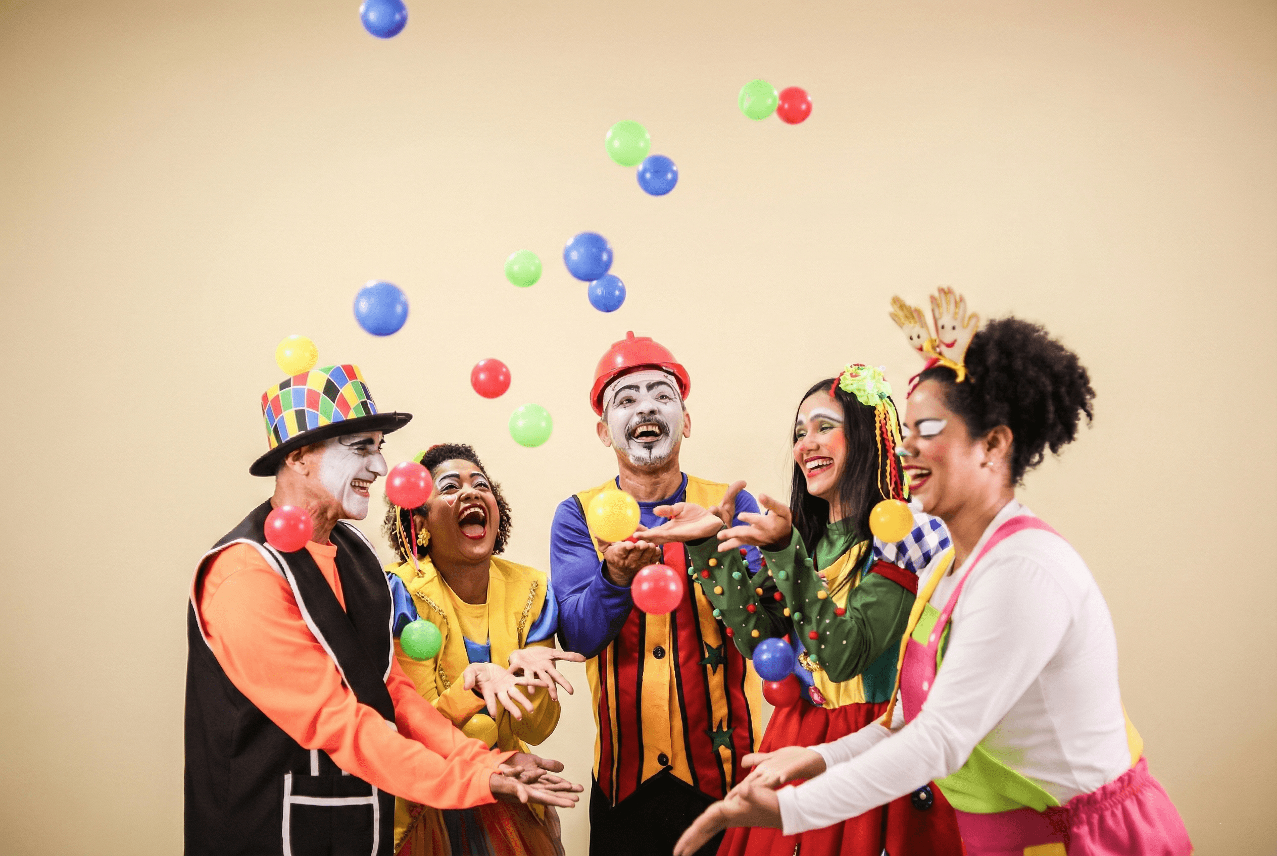 Theatrical performance on stage with colorful lighting, dancers in artistic costumes, dramatic cultural event